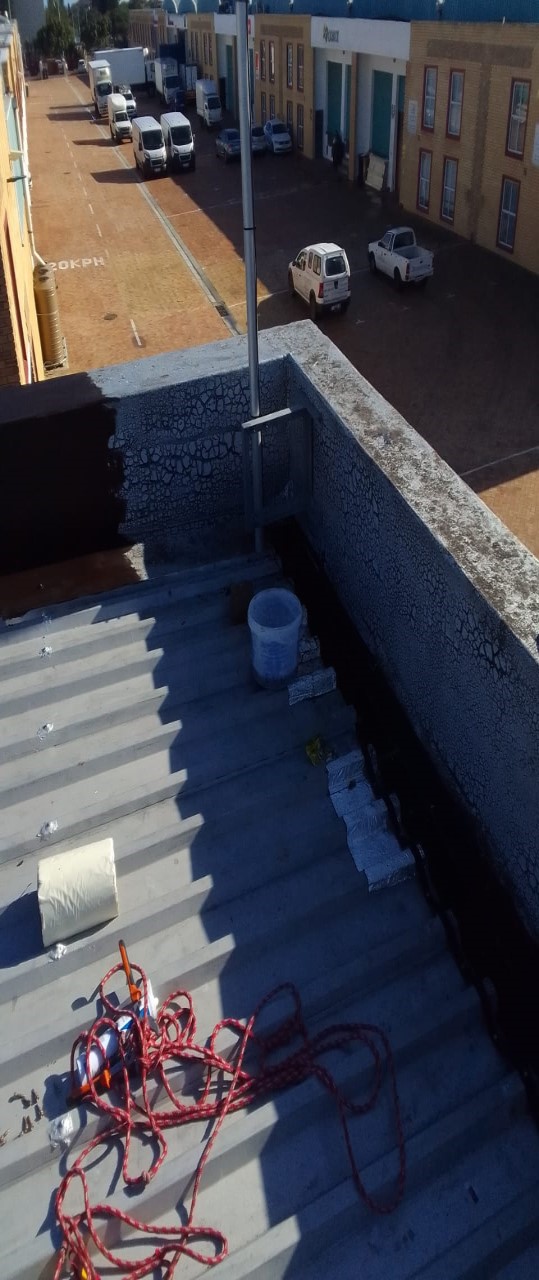 Roof waterproofing work in progress
